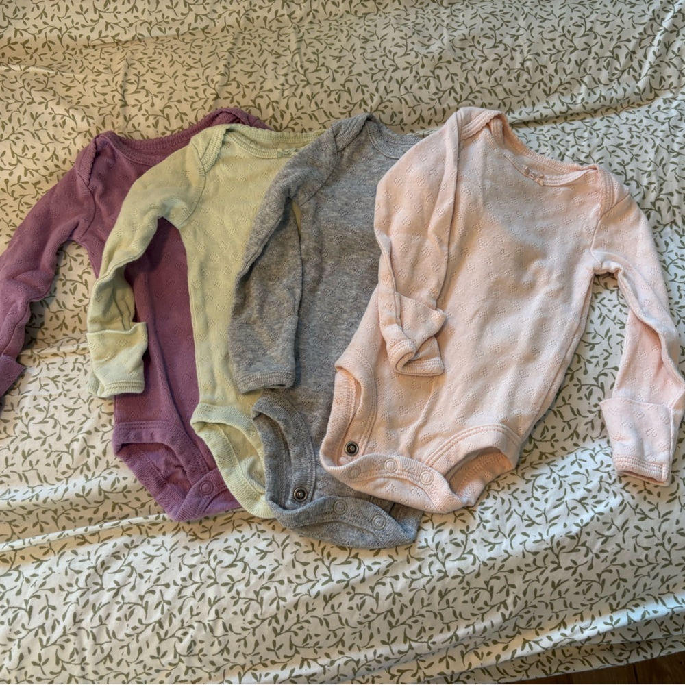 Set of Four Baby Onesies in Pastel Colors